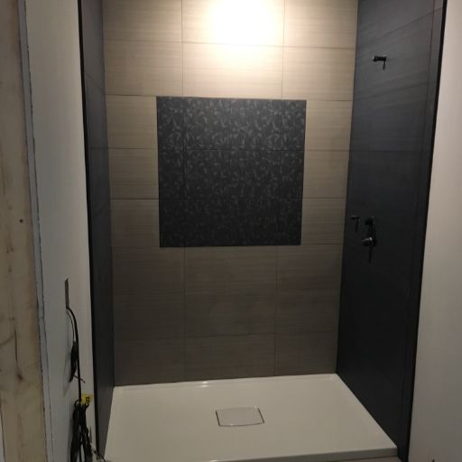 Dark custom tiled shower